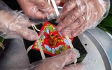 Cảnh sát cơ động Hà Nội thi tài gói bánh chưng đón Tết Quý Mão 2023, mang sắc xuân trên phố phường ảnh 7